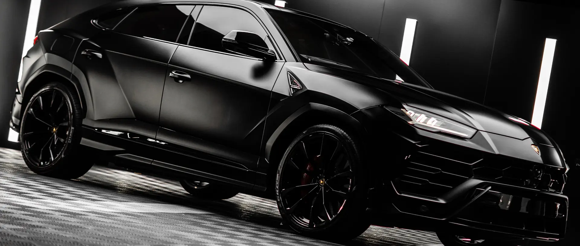 Satin black Lamborghini Urus finished in the Ink studio