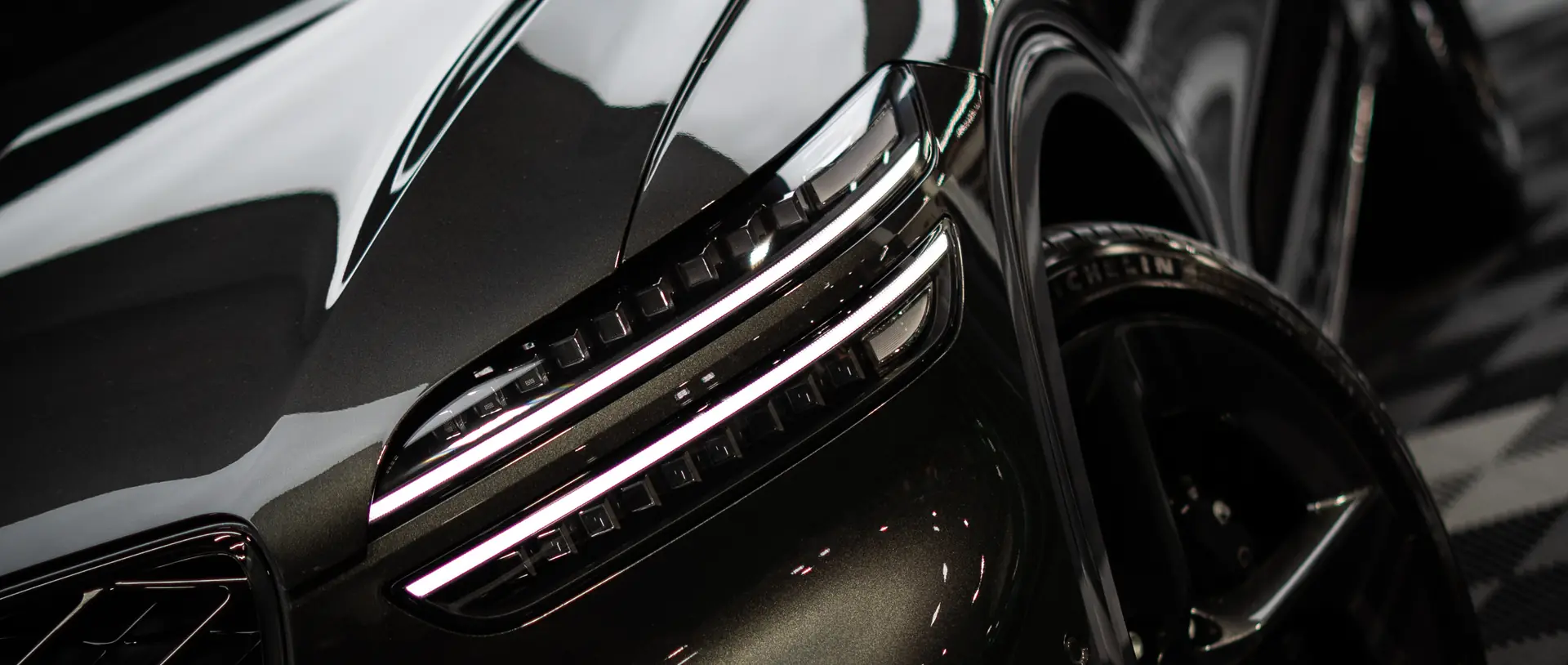Genesis GV80 under studio lighting after ceramic coating