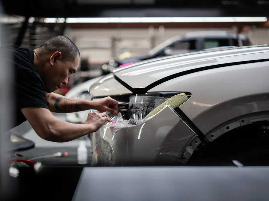Protection film applied to a rear spoiler